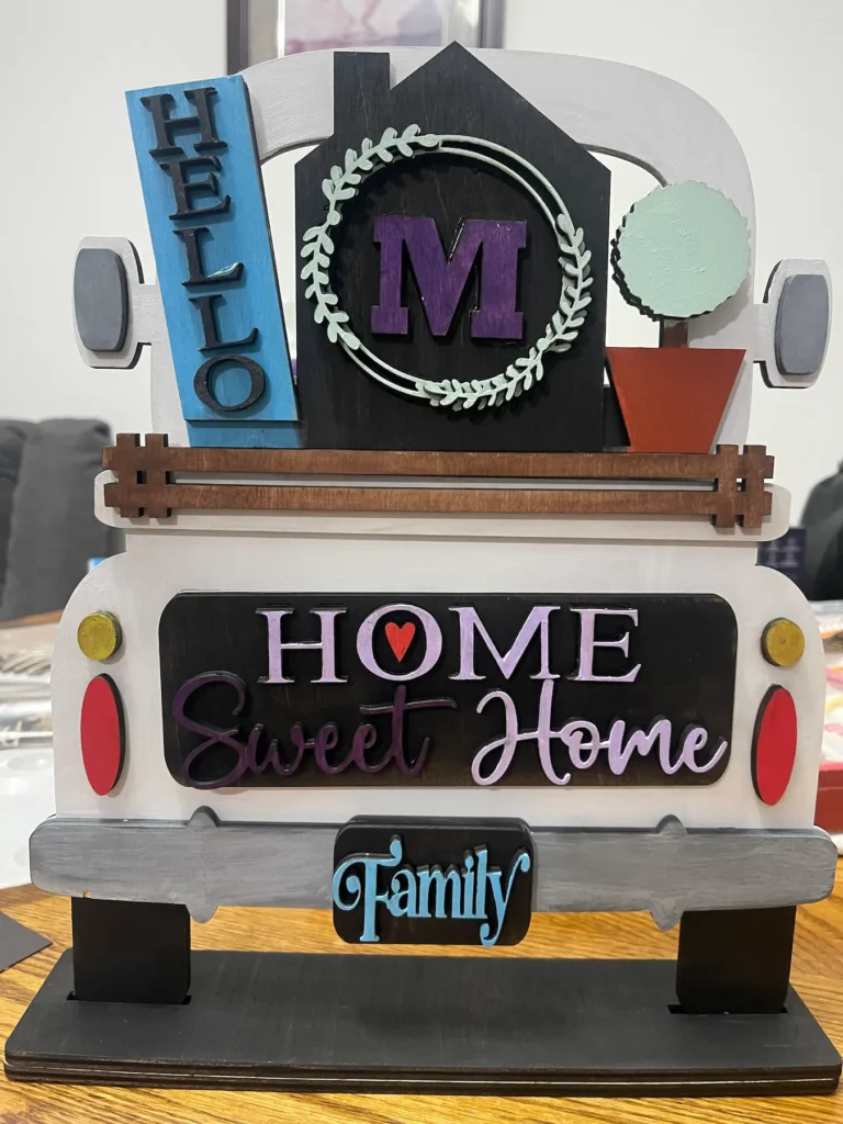 wooden hand painted back view of a truck with inserts to customize to home sweet home theme